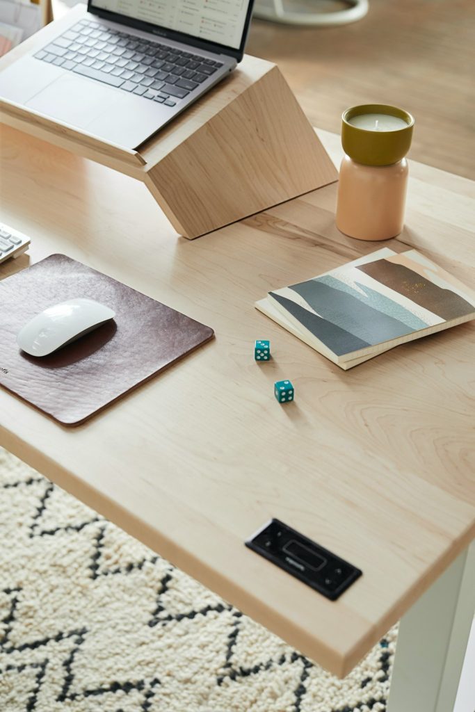 a-desk-with-a-laptop-and-a-mouse-on-it-wsemlnueaoa